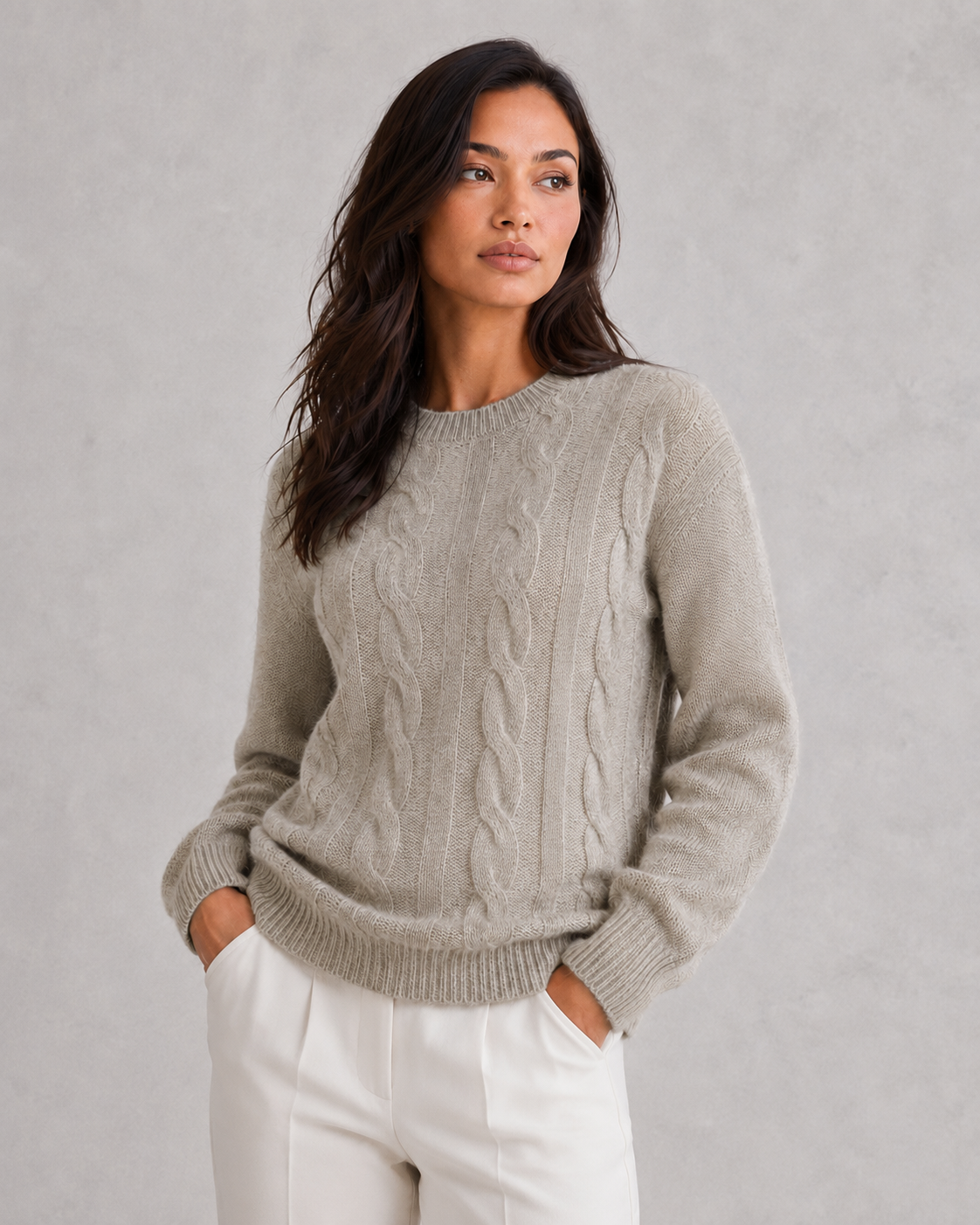 Woman wearing an ultra-soft knitted jumper with a relaxed fit, cozy texture, and modern silhouette styled for effortless everyday elegance.