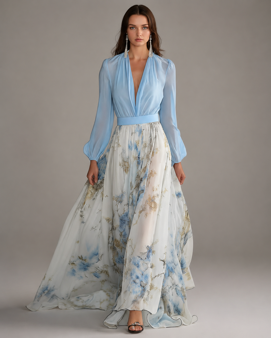 Women's floor-length floral maxi dress with a deep V-neckline, long gathered sleeves, a solid-color waistband, and a flowing multi-tone floral print skirt in a relaxed, elegant silhouette.