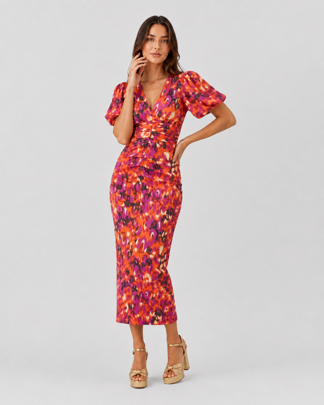 Womenโs Klyne Studios printed midi dress with a V-neckline, structured puff sleeves, relaxed fit, and soft waist shaping for a modern, versatile look.