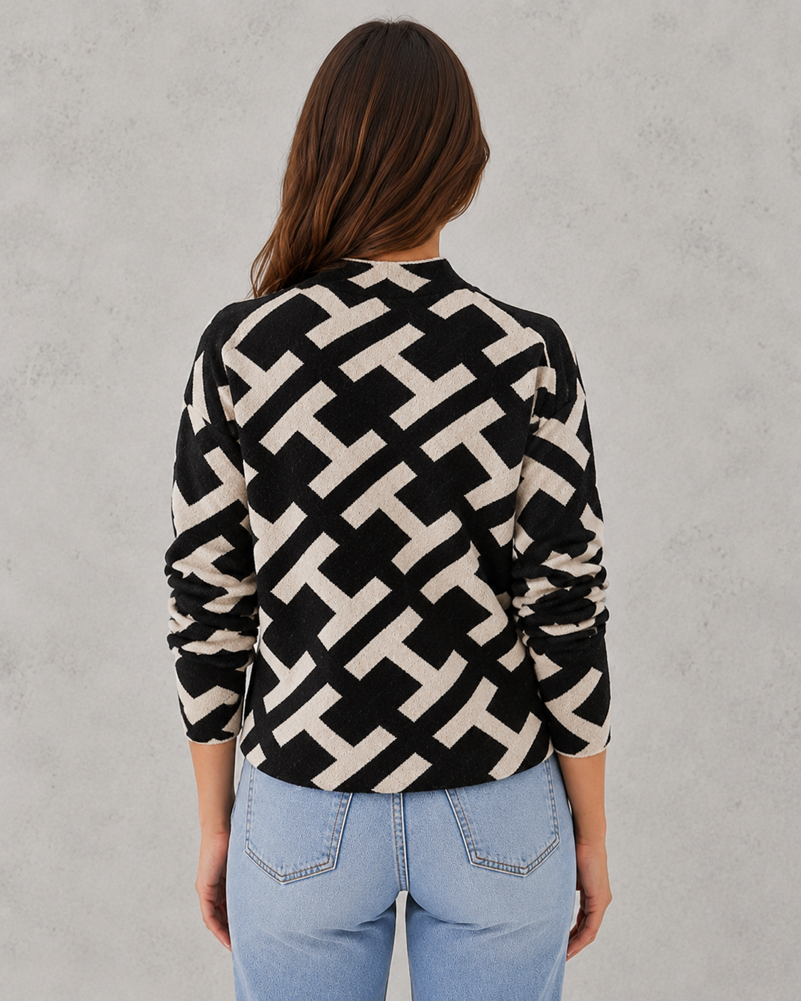 Woman wearing a soft velvet yarn turtleneck sweater with a refined silhouette and elegant winter styling.