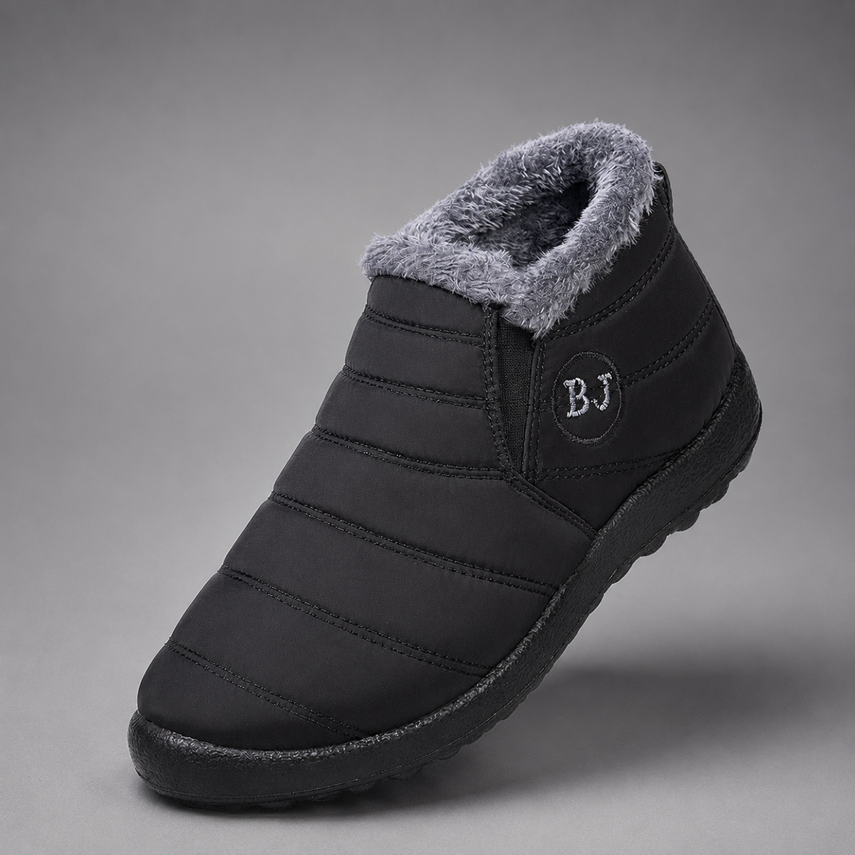 Women’s waterproof snow boots with a quilted upper, warm faux fur lining, round toe, slip-on design, and durable non-slip outsole.