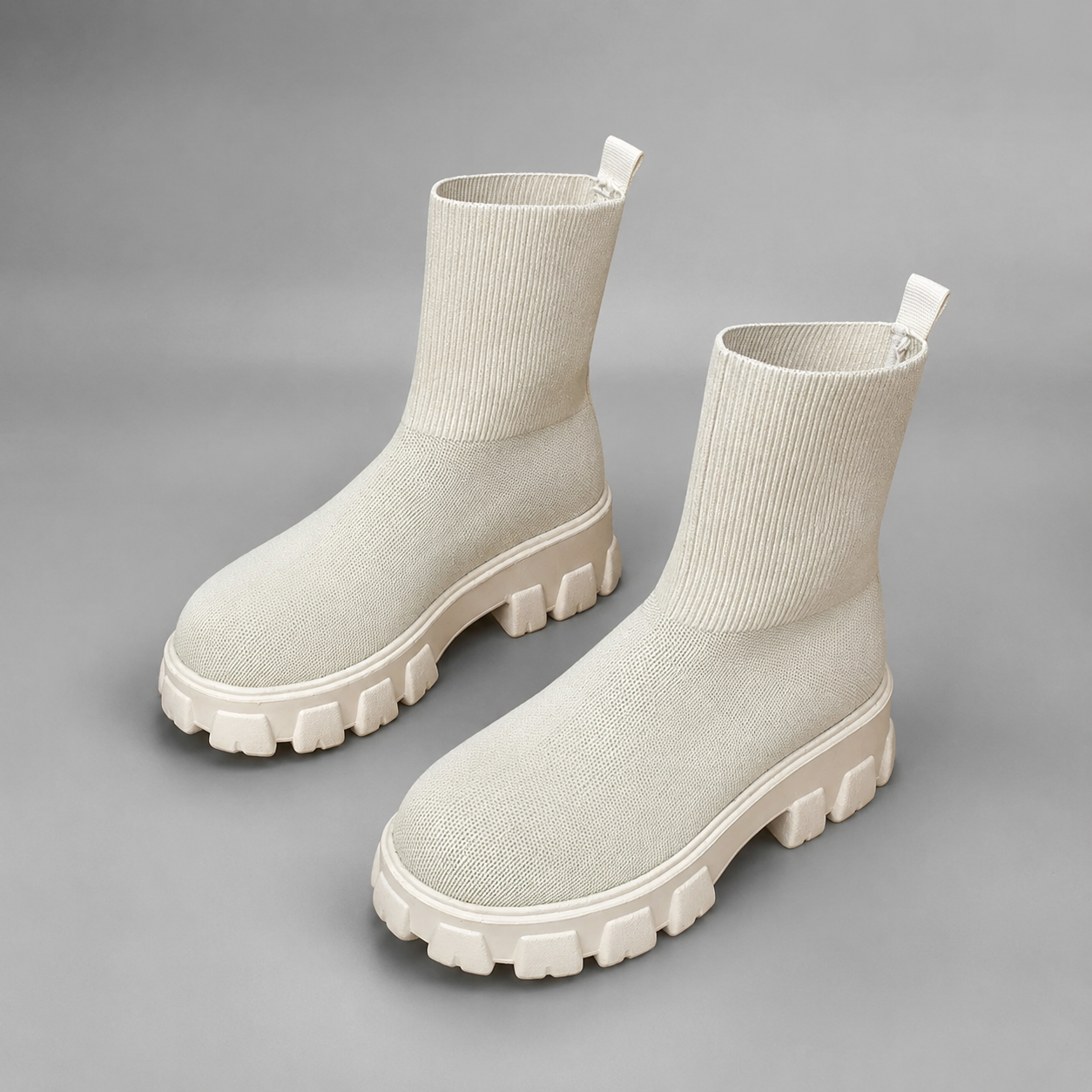 Women's waterproof stretch ankle boots with a faux fur lining, slip-on design, lace-up detail and non-slip rubber sole for warm, comfortable everyday autumn and winter wear.