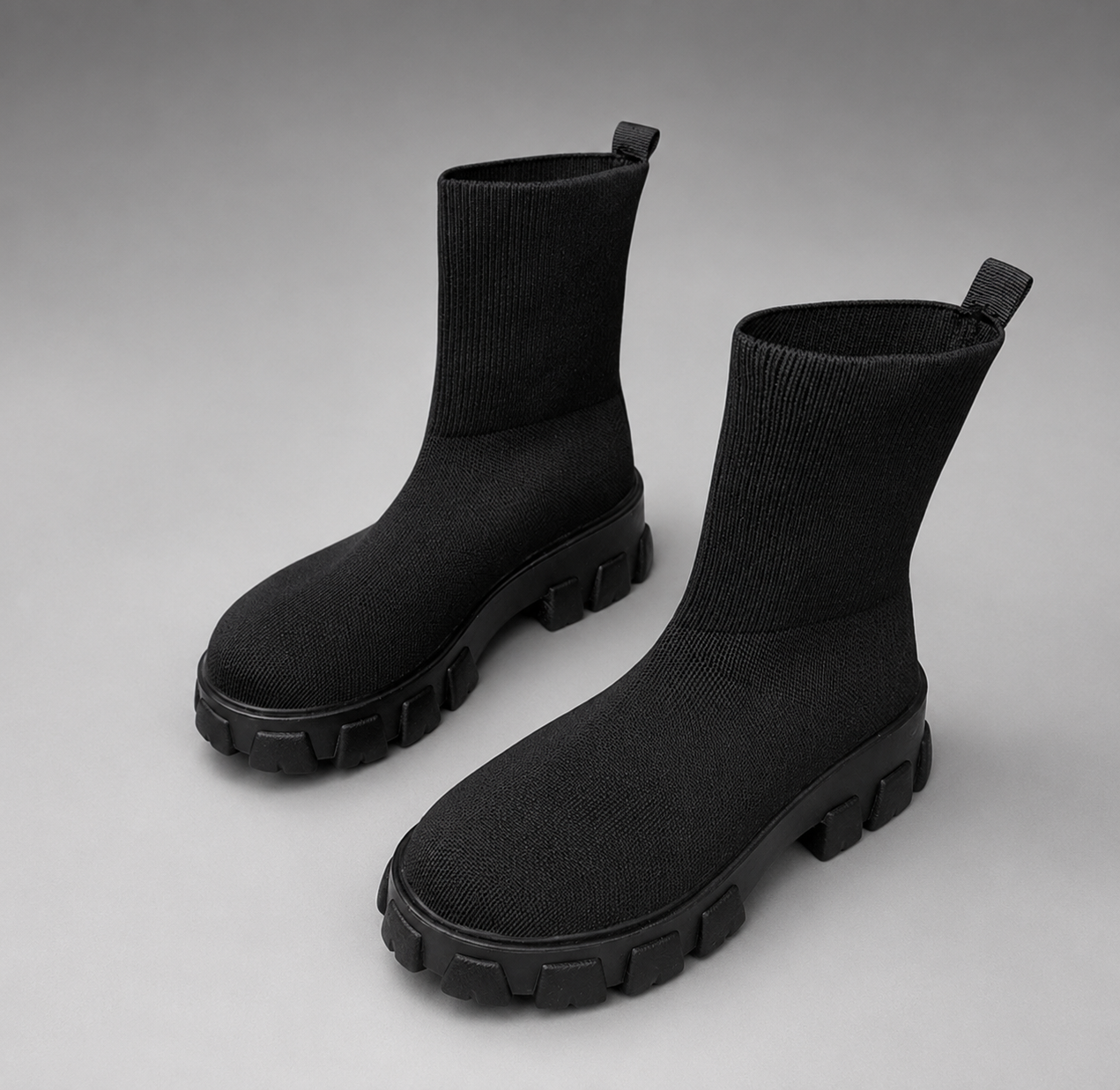 Women's waterproof stretch ankle boots with a faux fur lining, slip-on design, lace-up detail and non-slip rubber sole for warm, comfortable everyday autumn and winter wear.