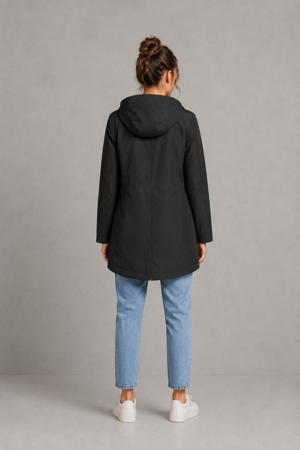 Women’s waterproof windproof hooded coat with lightweight performance fabric, an adjustable protective hood and a flattering regular-fit silhouette.