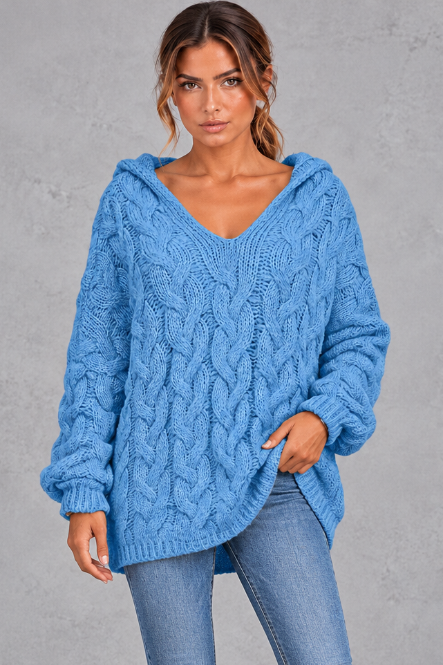 Back view of oversized cable knit hooded sweater