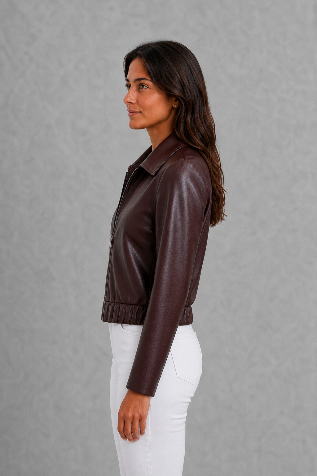 Women’s wine faux leather biker jacket with a smooth leather-look finish, zip-front closure, structured tailored fit, and streamlined moto-inspired silhouette.