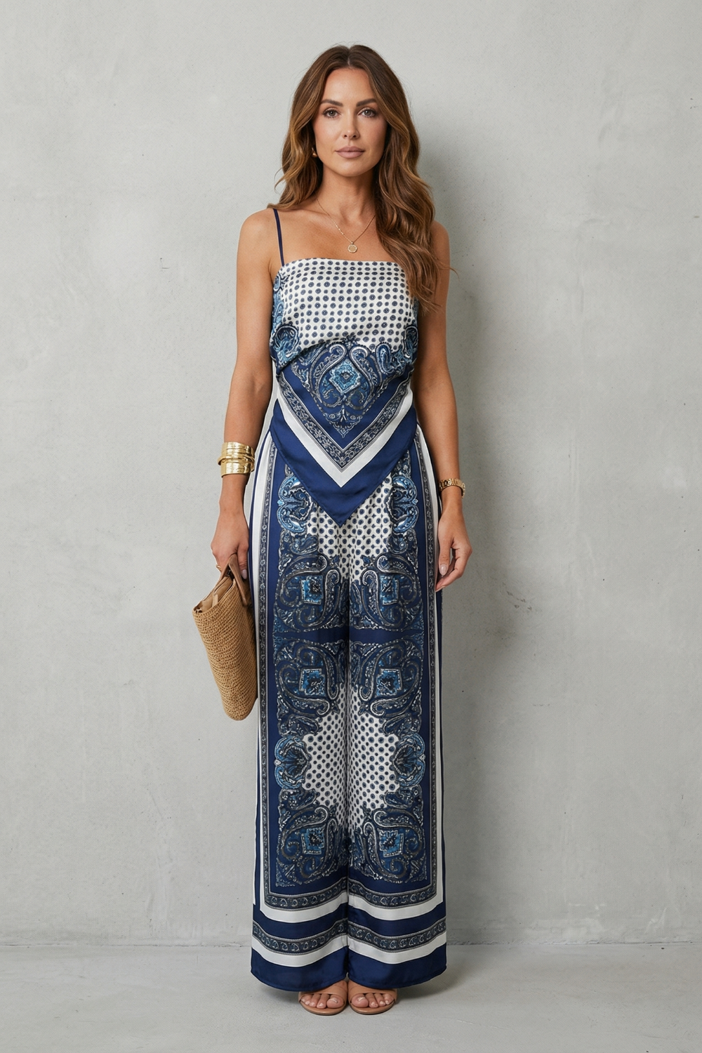 Side view of the fitted strap top and high-waisted wide-leg pants