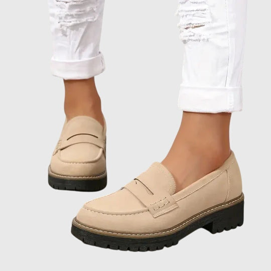 Women’s suede slip-on loafers with classic design and non-slip sole.