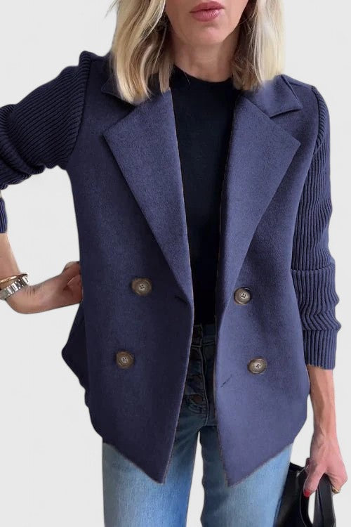 Women’s tailored blazer jacket with contrast sleeves and double-breasted front.