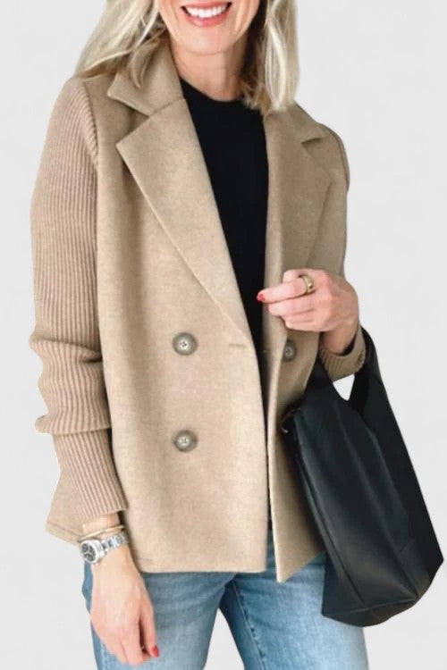 Women’s tailored blazer jacket with contrast sleeves and double-breasted front.