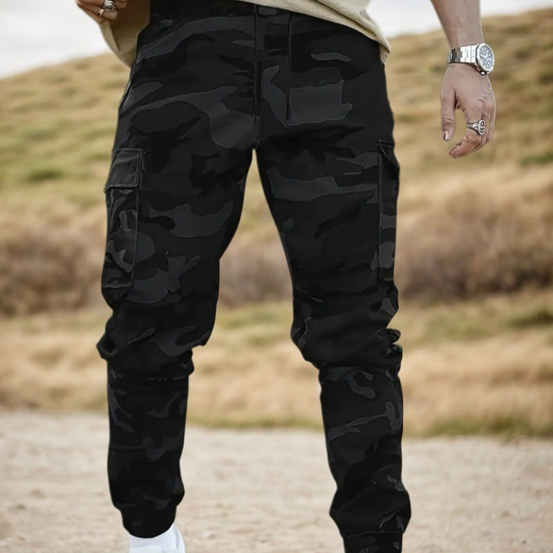 Men’s durable camo cargo work pants with multiple pockets, straight-leg fit, and rugged cotton-polyester fabric for work, outdoor activities, and everyday wear.