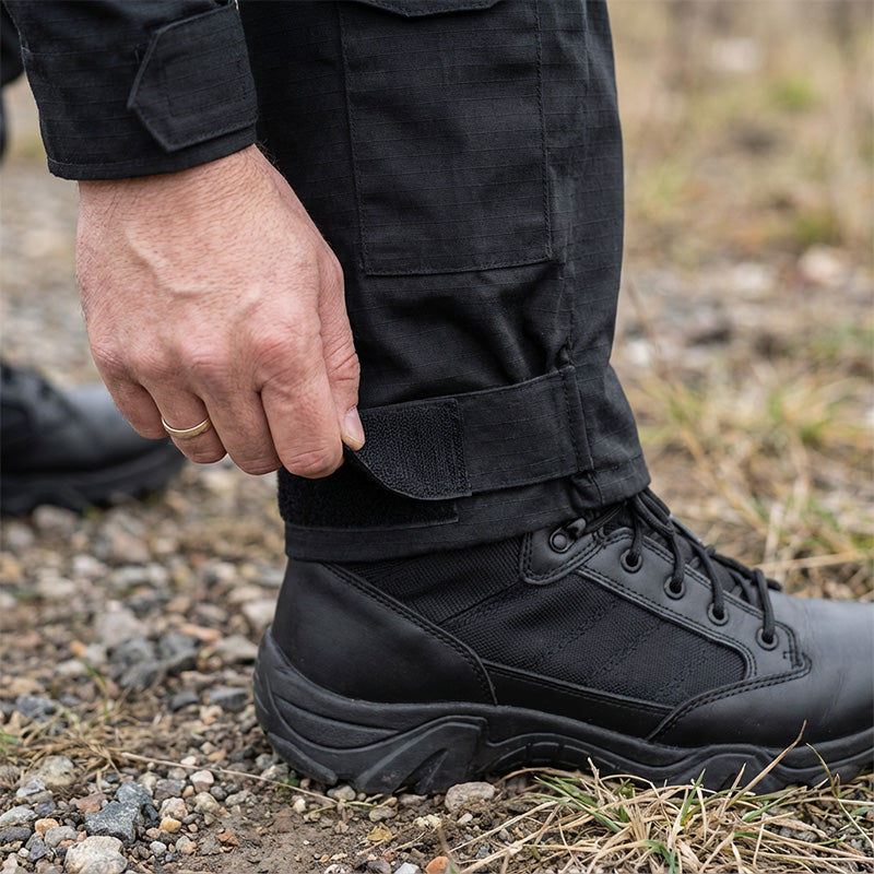 Men’s tactical cargo pants with integrated knee pads, adjustable straps, multiple pockets, and durable cotton-polyester fabric for outdoor work and rugged activities.