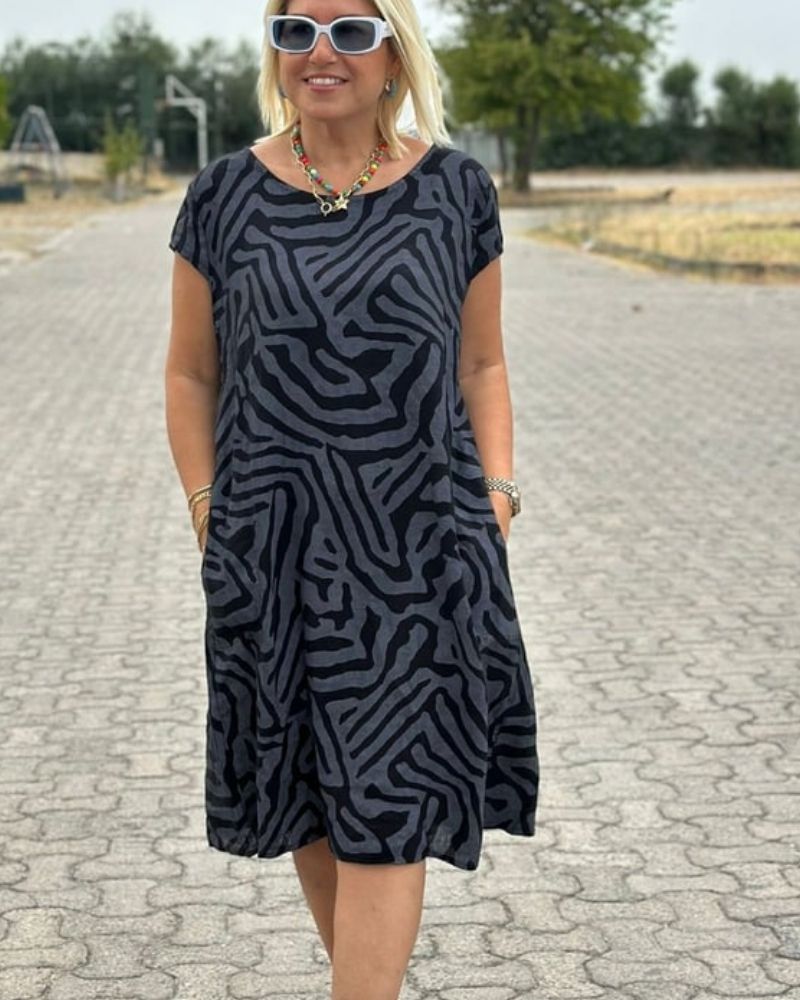 Women’s cotton A-line vintage dress with flared sleeves and relaxed fit.