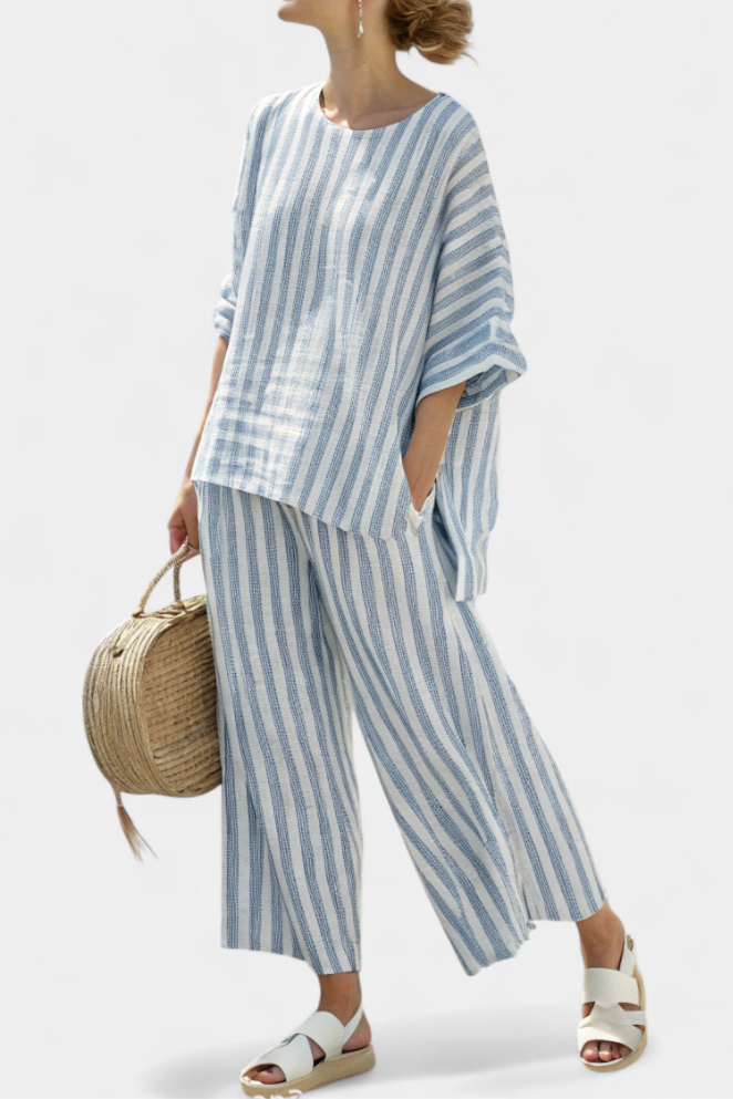 Women’s blue striped top and relaxed pants designed for breathable comfort and effortless summer style.