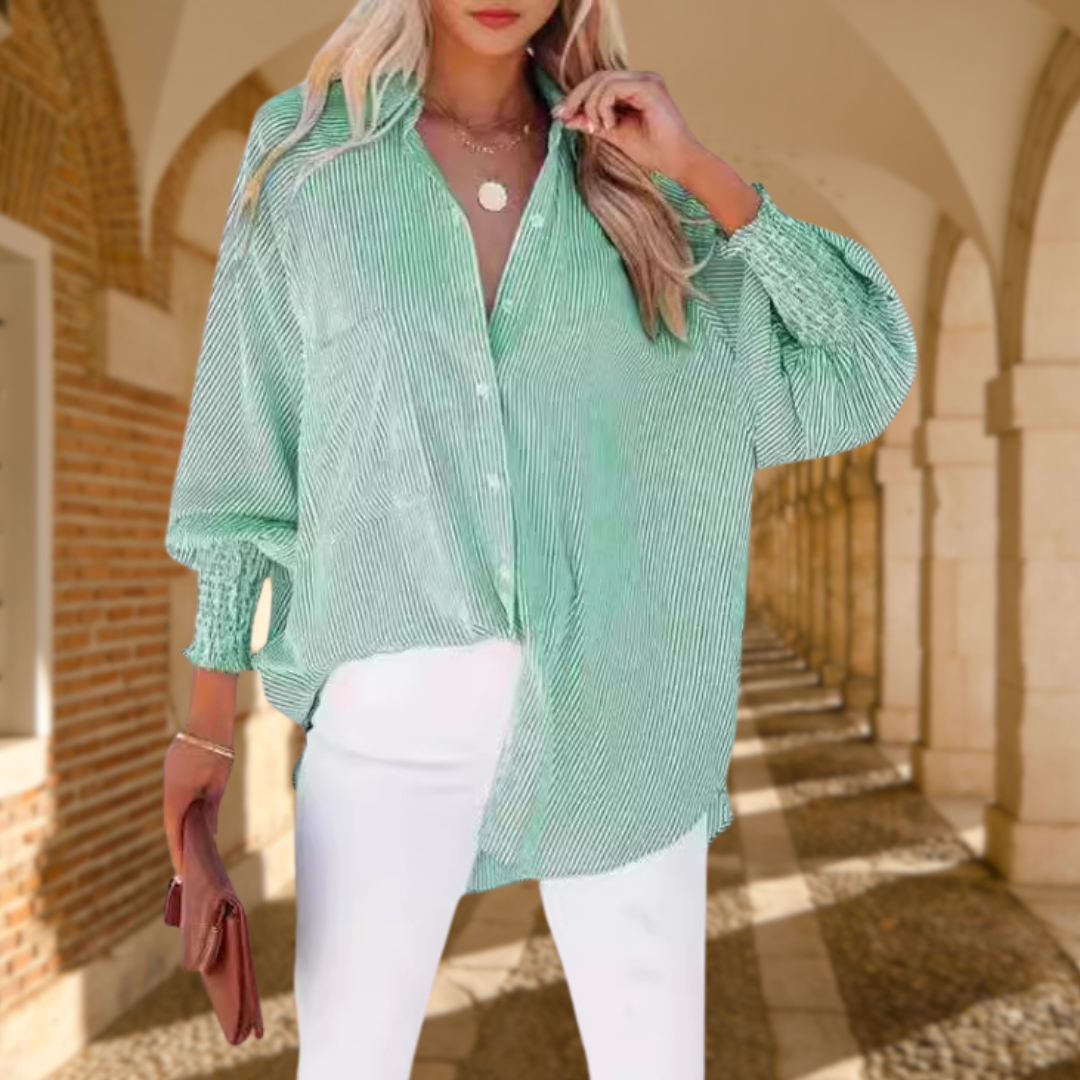Women’s cotton blend button-up shirt with collar, relaxed fit, and lightweight fabric designed for comfortable everyday wear.