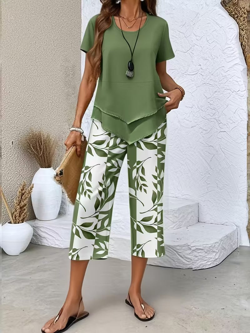 Women’s two-piece outfit featuring a relaxed top and leaf print trousers designed for lightweight and comfortable everyday wear.