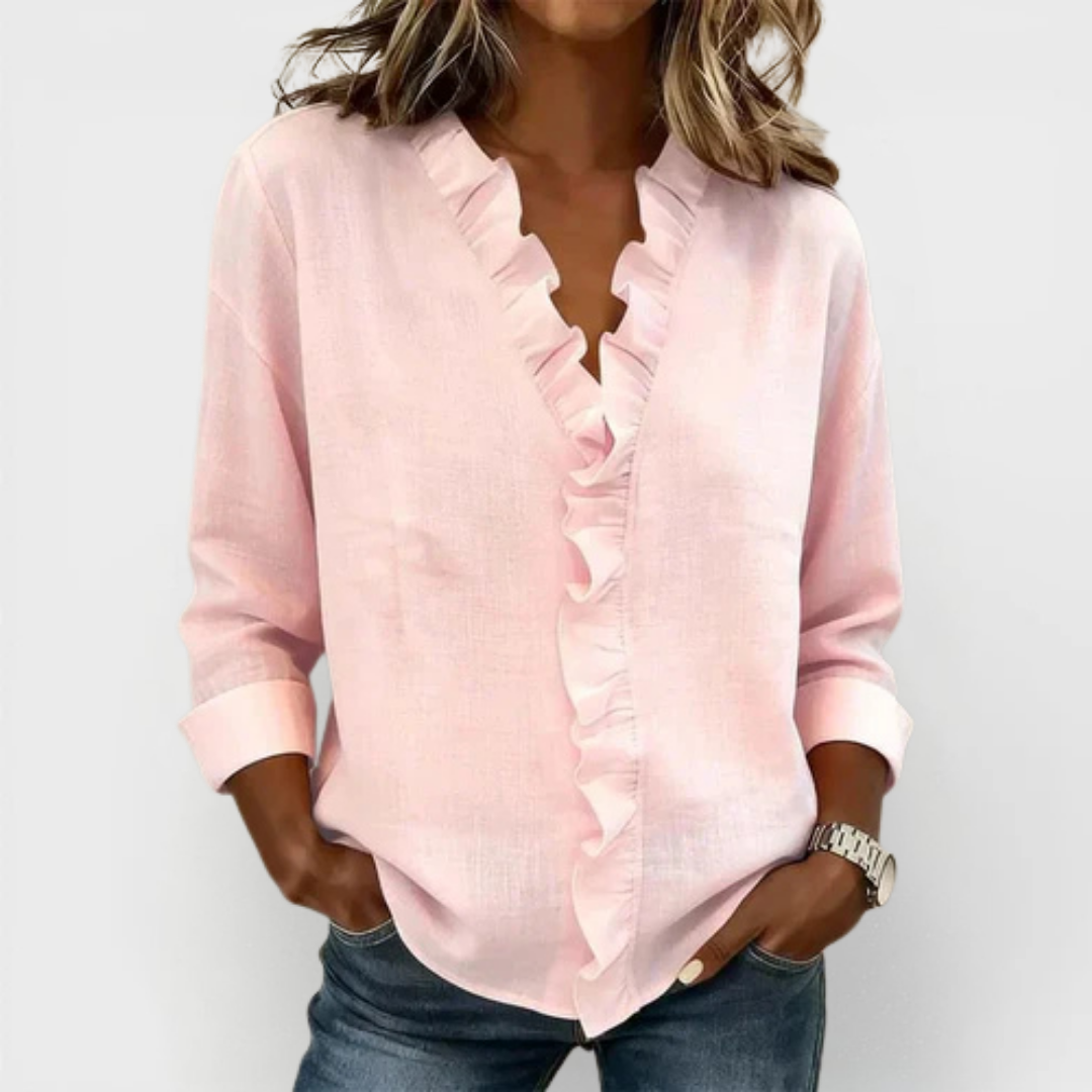 Women’s lightweight blouse with ruffled V-neckline, long sleeves, and clear cuffs, providing a relaxed, flattering silhouette for everyday wear.