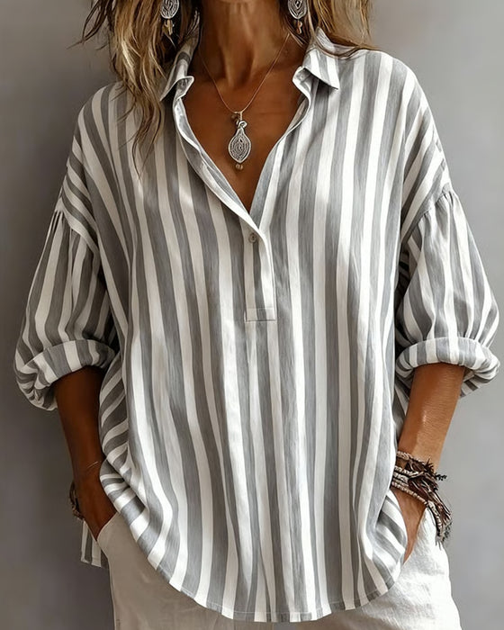Women’s loose striped blouse with collar, relaxed fit, breathable fabric, and timeless vertical stripes for casual and versatile styling.