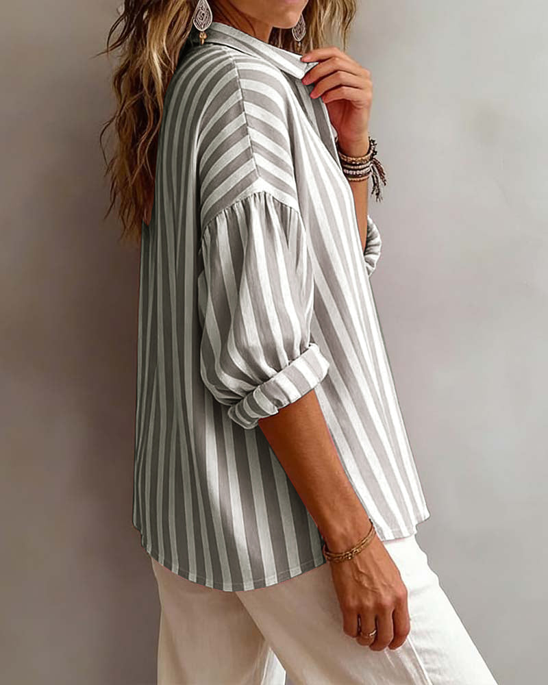Women’s loose striped blouse with collar, relaxed fit, breathable fabric, and timeless vertical stripes for casual and versatile styling.