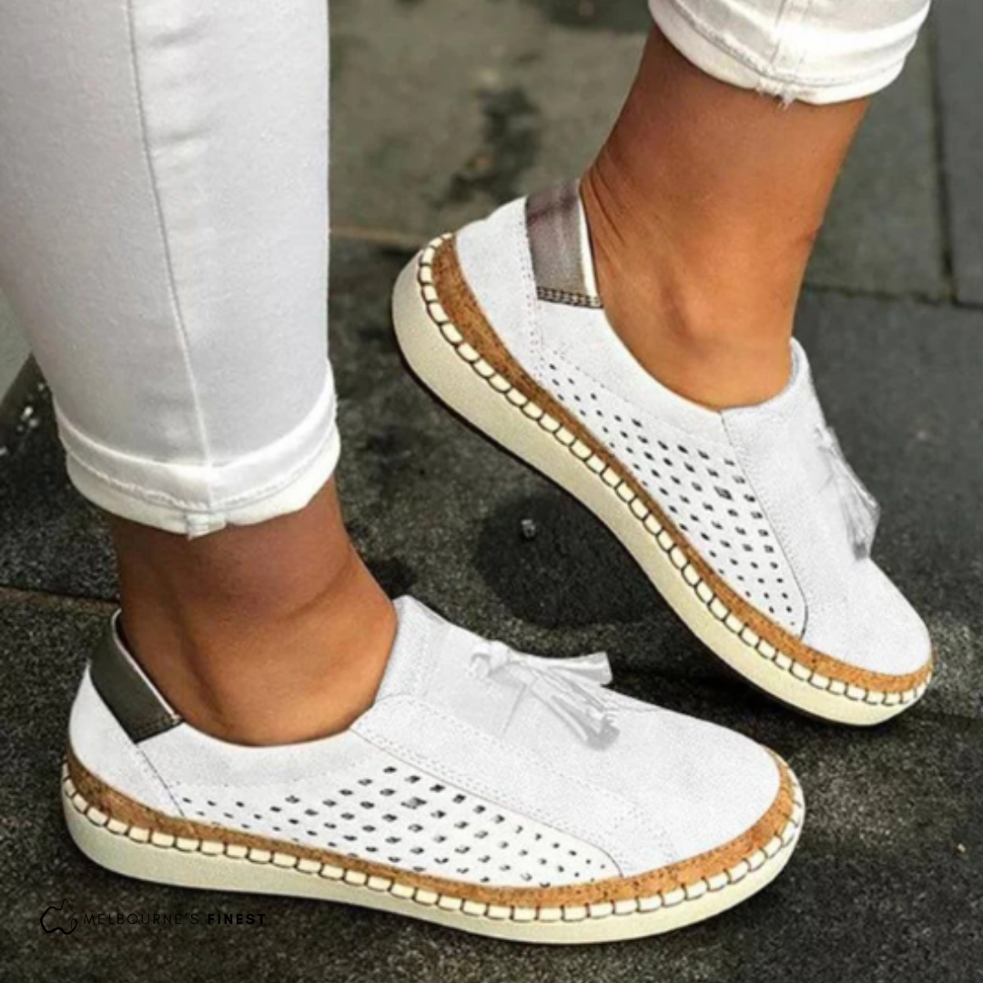 Women’s comfortable slip-on sneakers with breathable fabric and cushioned sole for everyday wear.