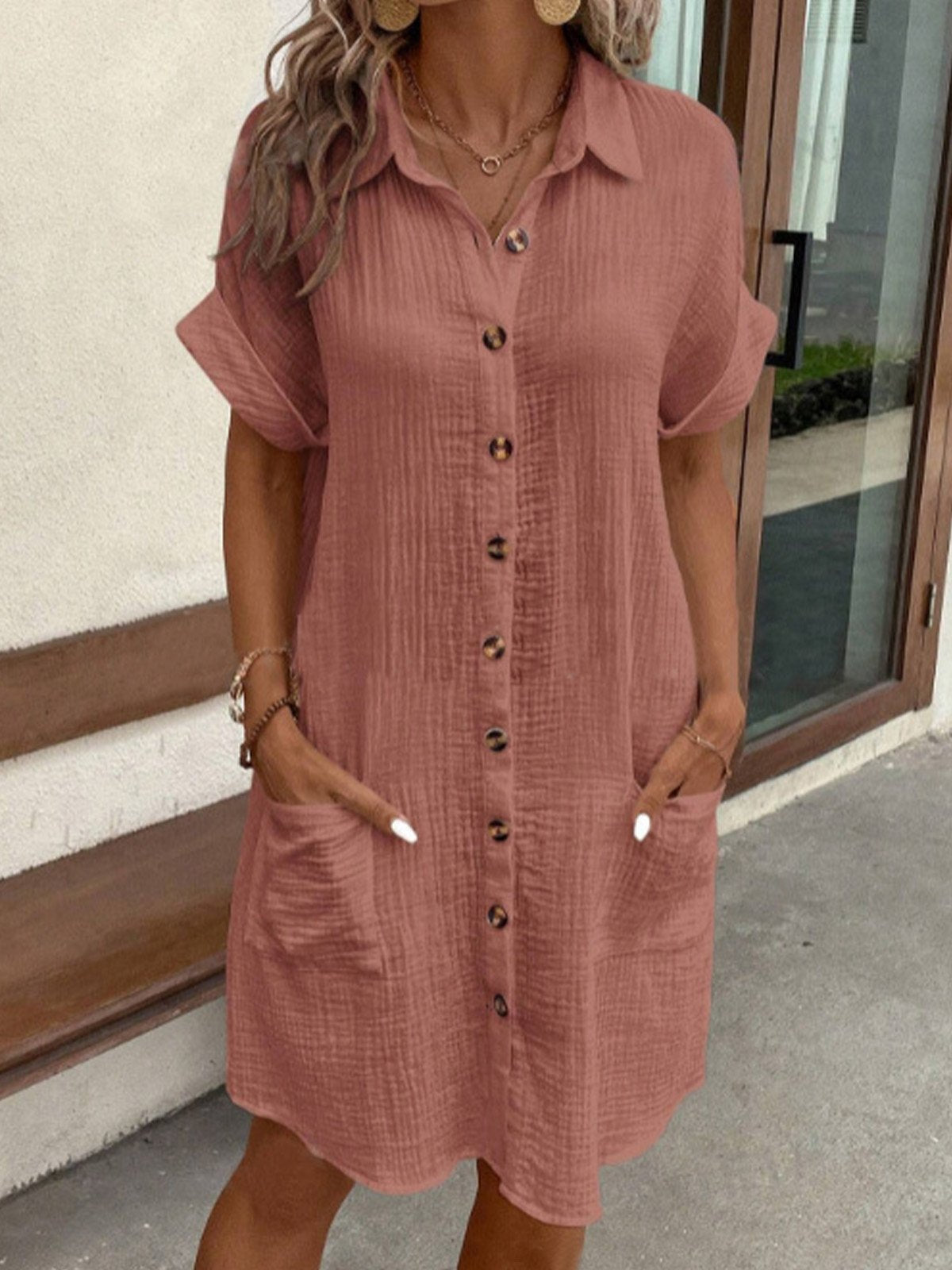 Women’s casual polo dress with collared neckline, breathable fabric, and functional pockets for everyday wear.
