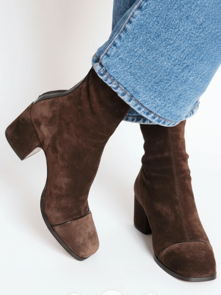 Women’s suede ankle boots with stable block heel and cushioned insole designed for comfortable everyday wear.