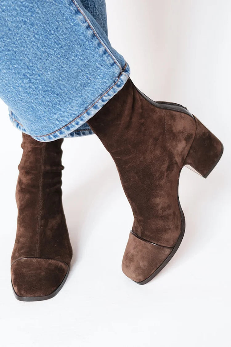 Women’s suede ankle boots with stable block heel and cushioned insole designed for comfortable everyday wear.