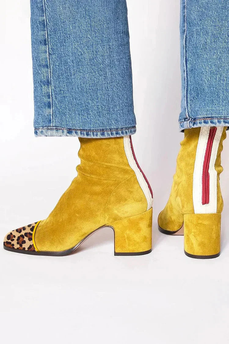 Women’s suede ankle boots with stable block heel and cushioned insole designed for comfortable everyday wear.