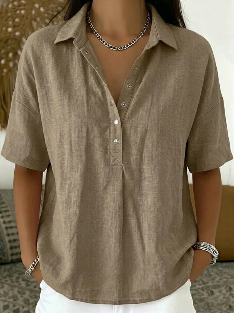 Women’s summer blouse with classic collar, button placket, and relaxed fit, ideal for casual and versatile summer styling.