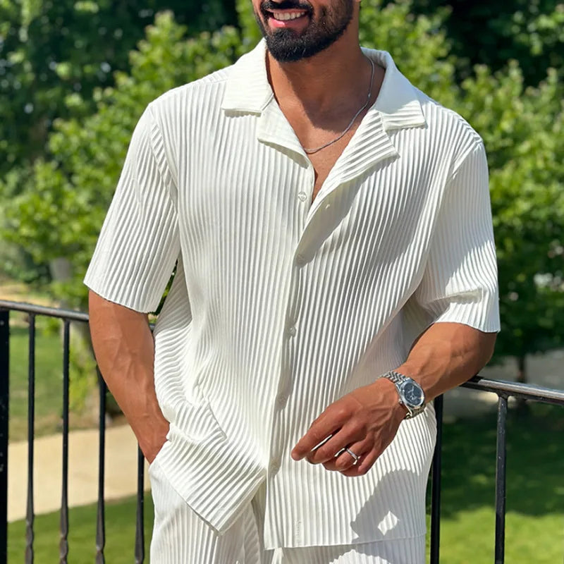 Men’s pleated two piece set with camp collar short sleeve shirt and straight leg trousers in lightweight textured fabric