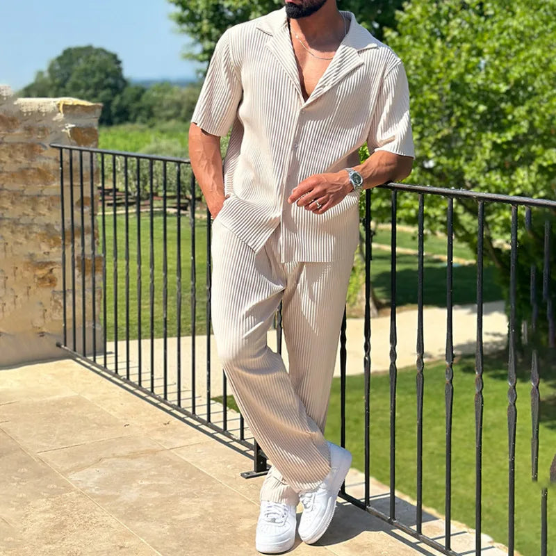 Men’s pleated two piece set with camp collar short sleeve shirt and straight leg trousers in lightweight textured fabric