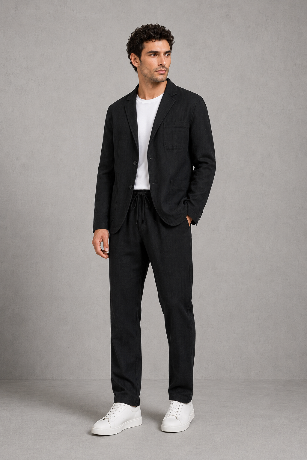 Menโs cotton-linen blend suit set featuring a relaxed tailored blazer and matching drawstring trousers.
