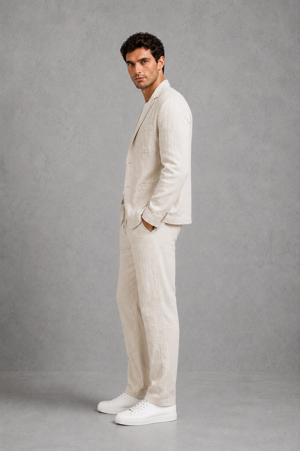 Menโs cotton-linen blend suit set featuring a relaxed tailored blazer and matching drawstring trousers.
