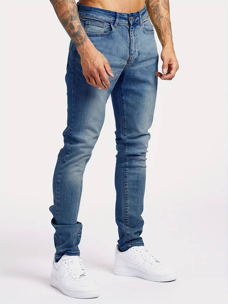 Menโs slim fit tapered denim jeans with mid rise waist and 5 pocket design for casual and smart casual wear