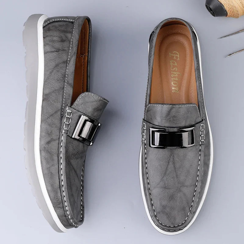 Menโs slip on loafers with metal bar detail moccasin stitching and chunky rubber sole for casual and smart casual wear