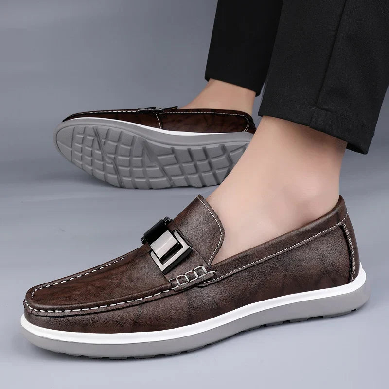 Menโs slip on loafers with metal bar detail moccasin stitching and chunky rubber sole for casual and smart casual wear