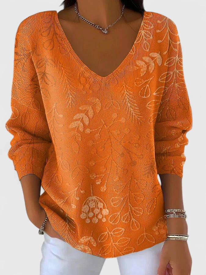 Women’s V-neck top with autumn pattern and relaxed fit