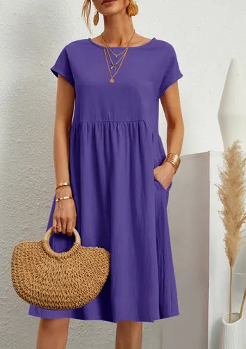 Women wearing a relaxed fit cotton linen vintage summer dress with breathable fabric for warm weather