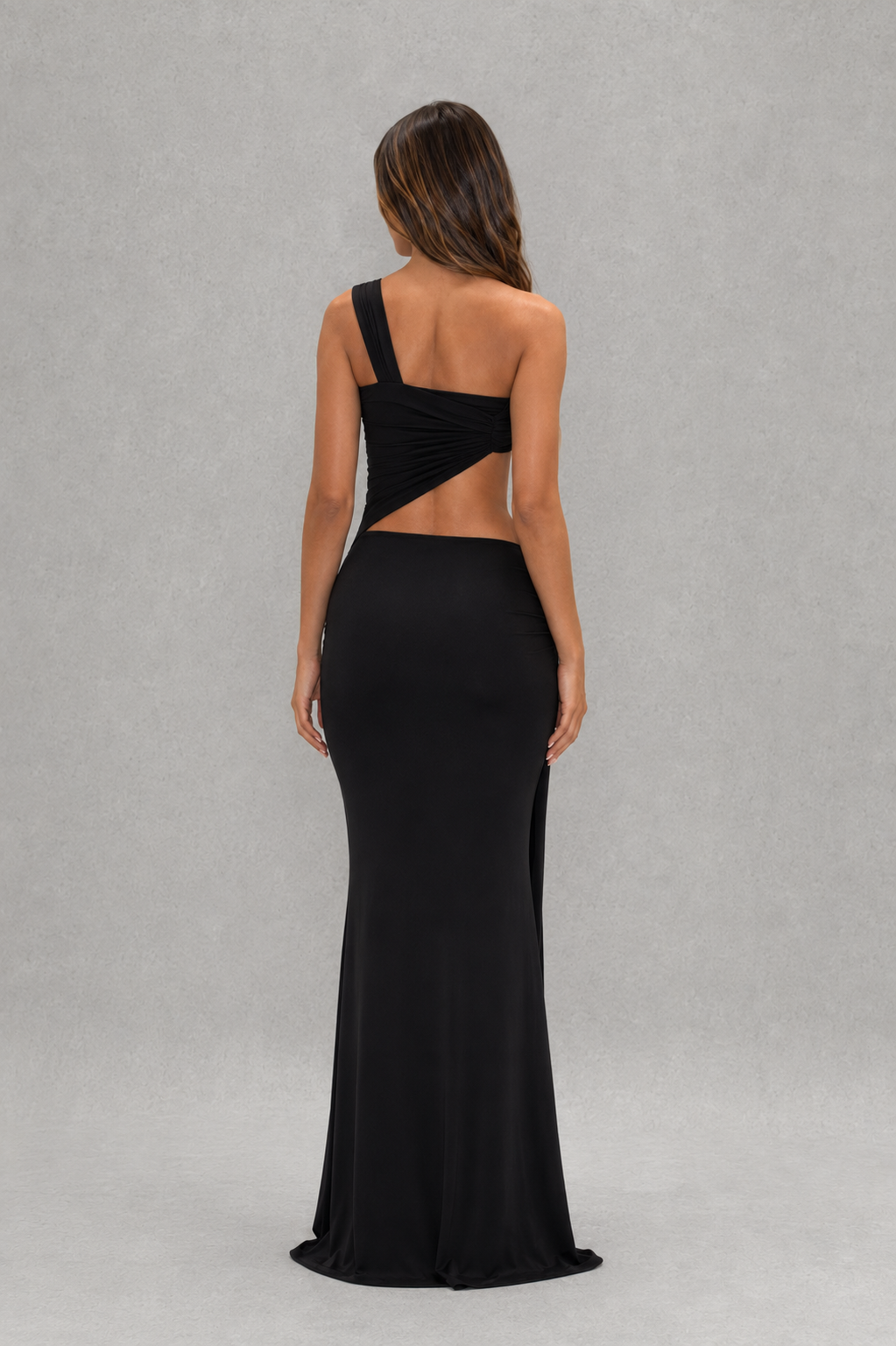 Womenโs asymmetric cut-out jersey maxi dress with sculptural neckline, fitted silhouette and elegant wrap-style floor-length skirt.