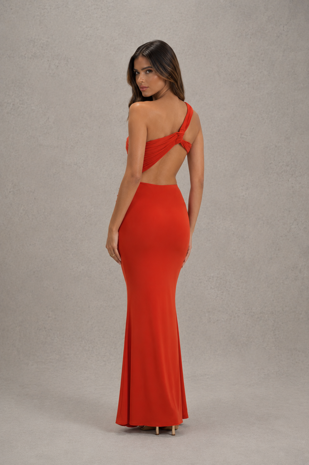 Womenโs asymmetric cut-out jersey maxi dress with sculptural neckline, fitted silhouette and elegant wrap-style floor-length skirt.