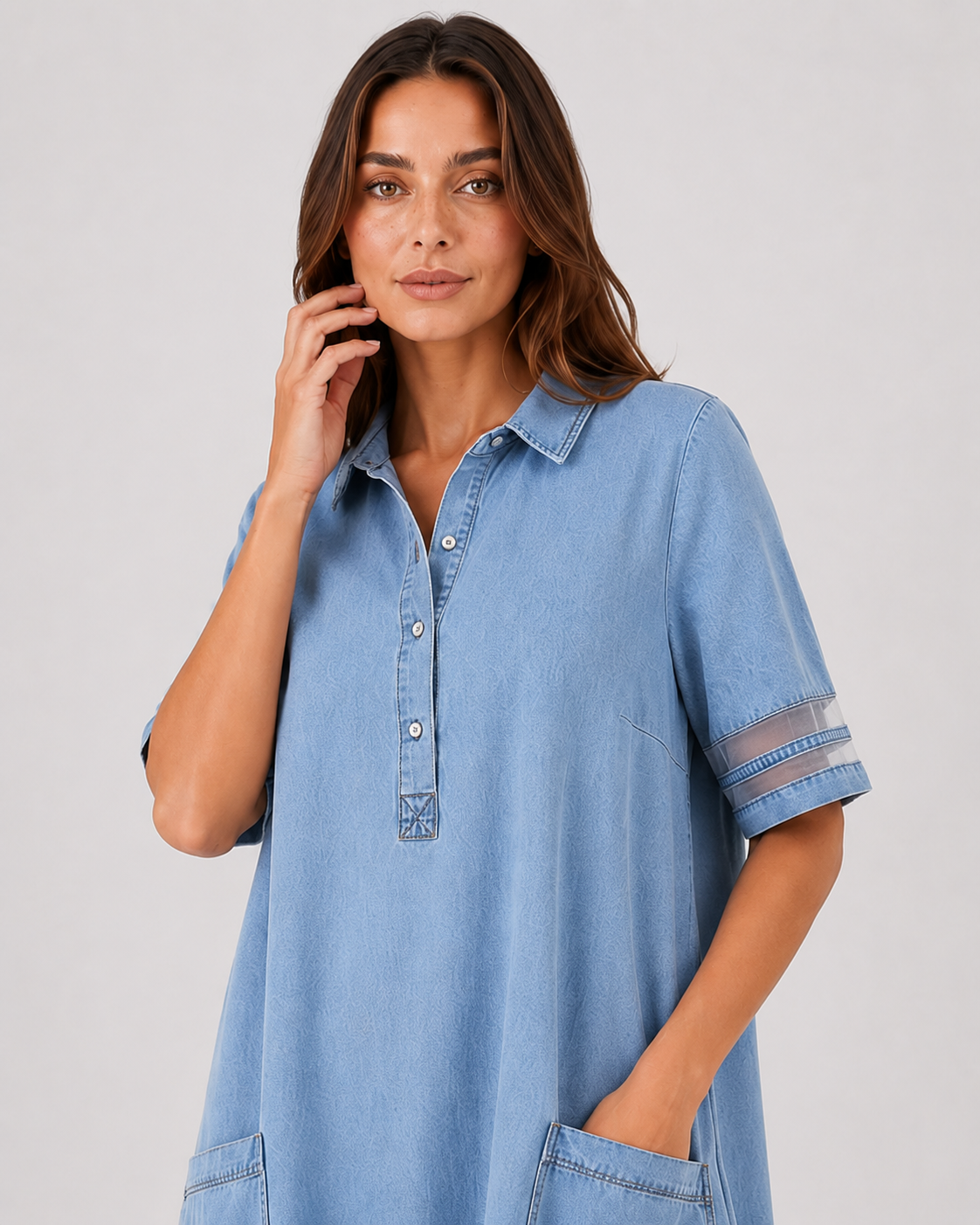 Women's denim shirt midi dress with a relaxed silhouette, button-front design, and soft denim fabric. A versatile casual dress ideal for everyday wear, styled with sneakers, sandals, or boots.