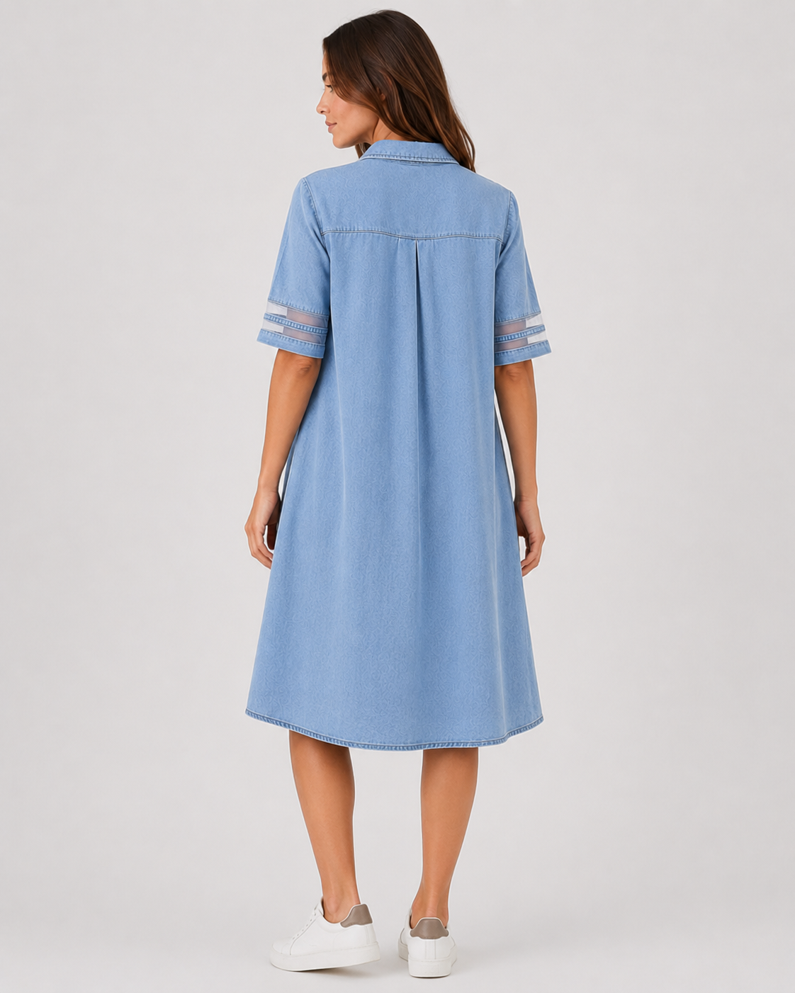 Women's denim shirt midi dress with a relaxed silhouette, button-front design, and soft denim fabric. A versatile casual dress ideal for everyday wear, styled with sneakers, sandals, or boots.