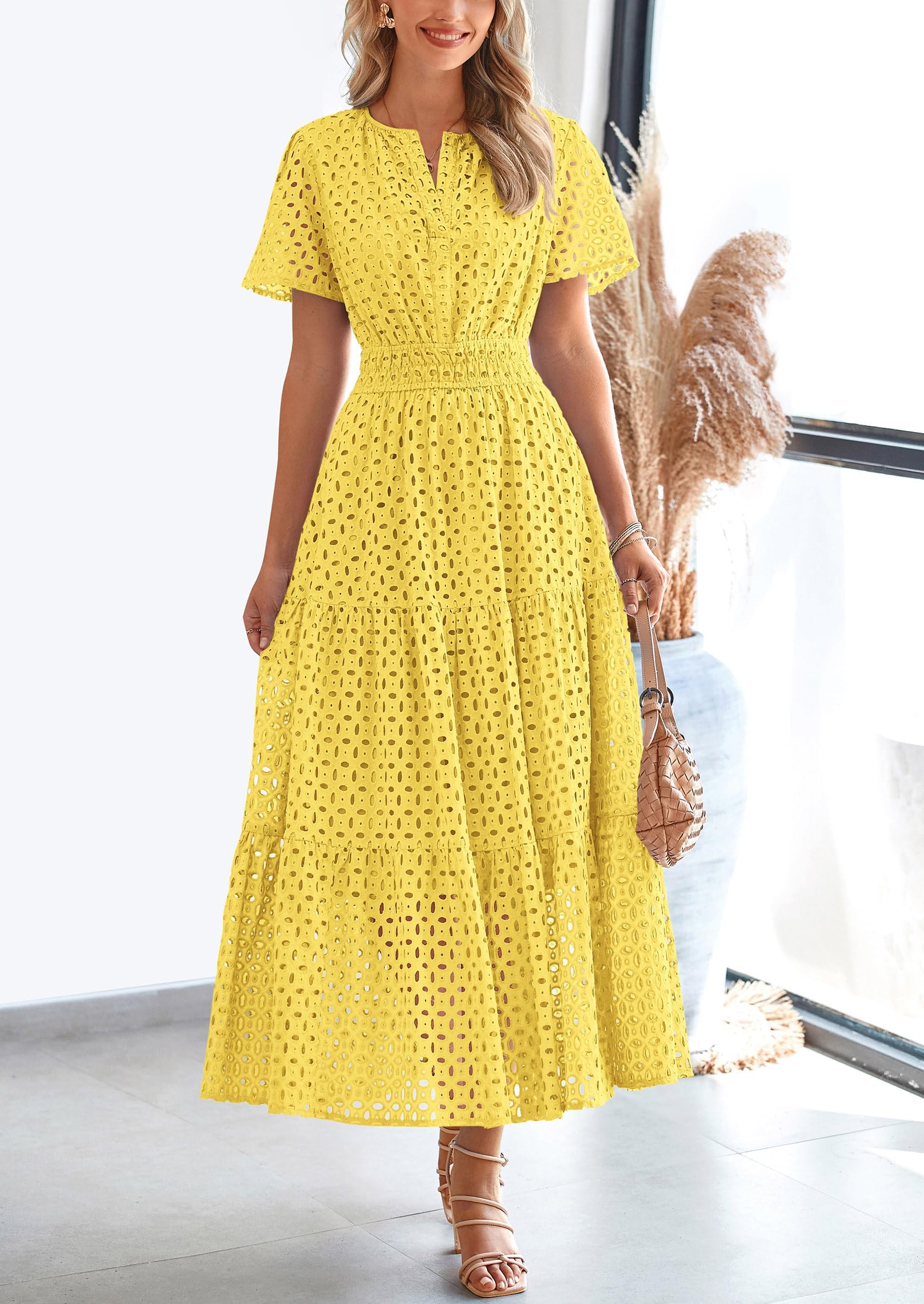 Womenโs eyelet cotton summer dress with A-line fit and lightweight breathable fabric for warm weather