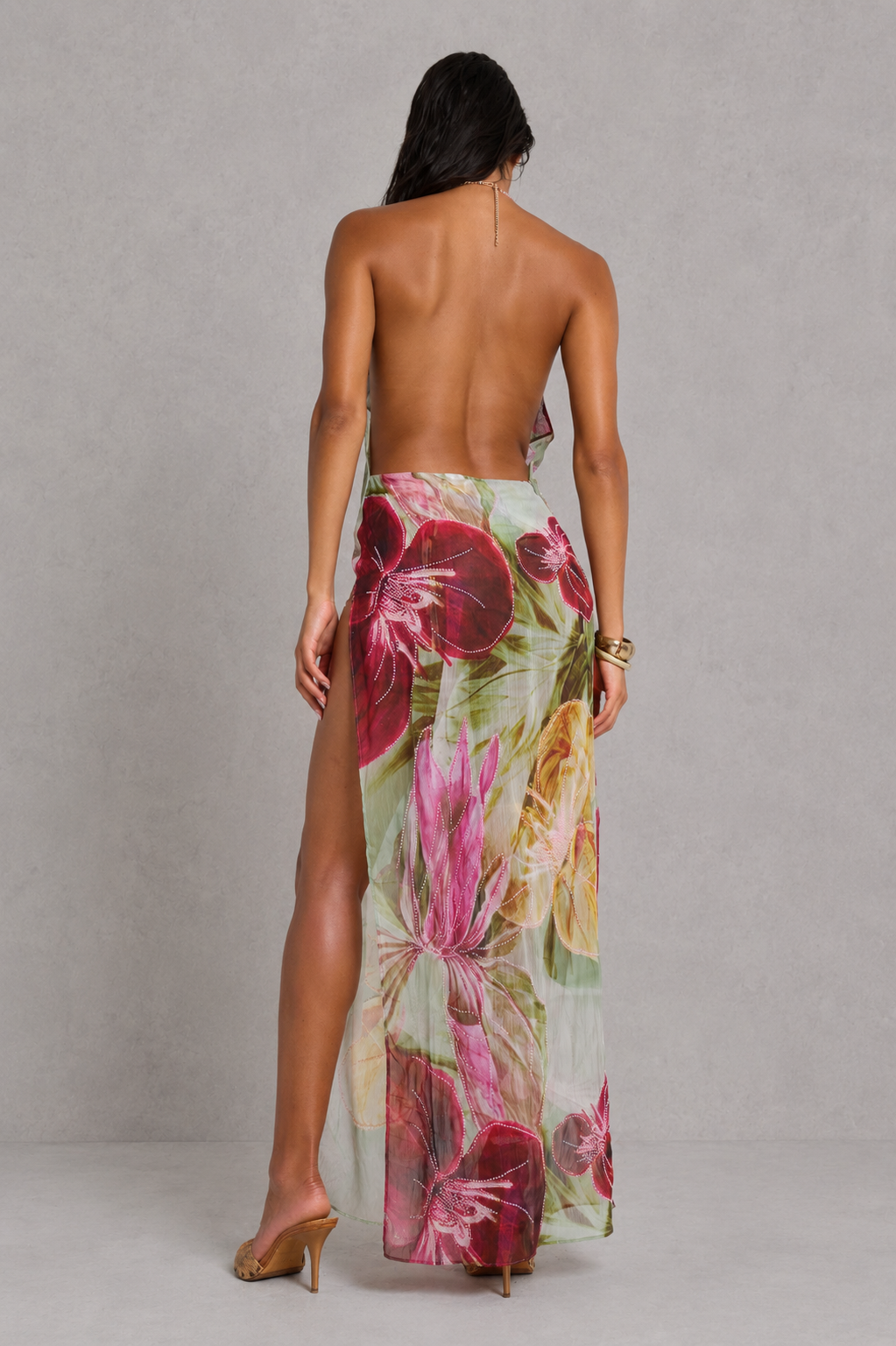 Women’s floral beaded maxi dress featuring intricate hand-beaded embellishments, a draped cowl neckline, open back design, sheer panel accents, and a flowing maxi silhouette with a side split for elegant evening and formal occasions.