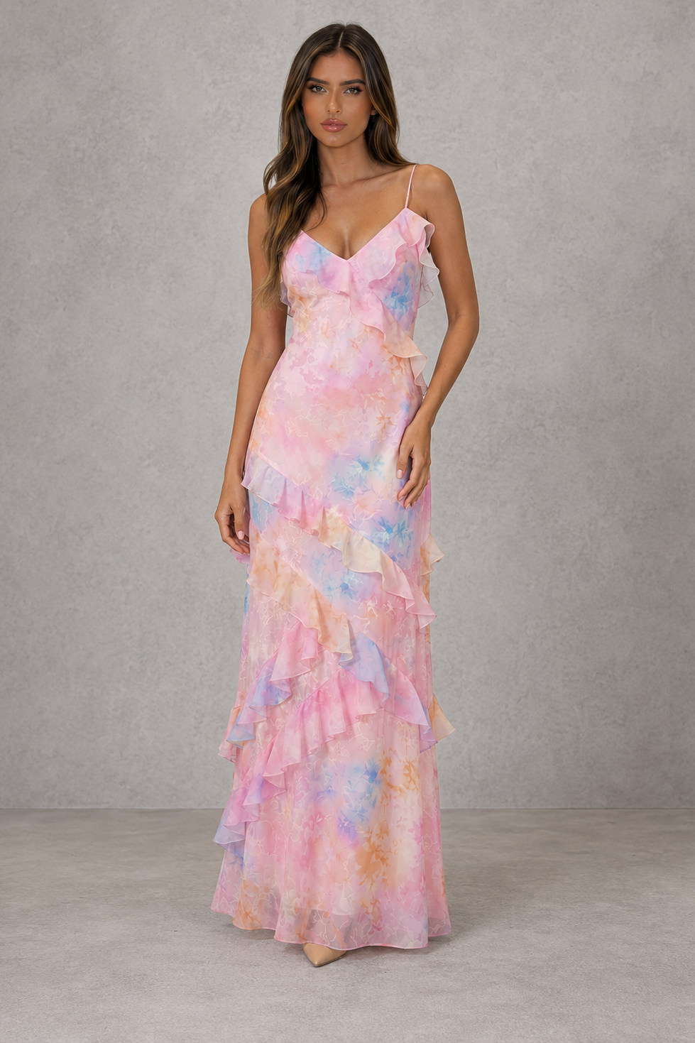 Womenโs floral chiffon maxi dress with V-neckline, adjustable shoulder straps, soft pastel print and cascading ruffle detail for wedding guest wear.