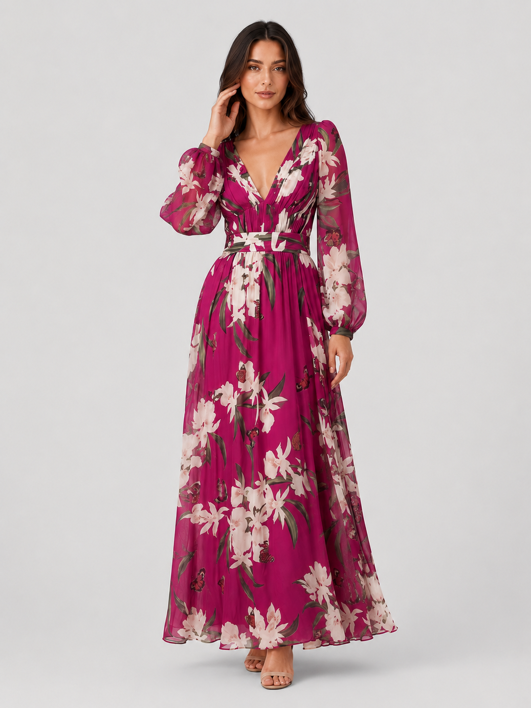 Woman wearing a lightweight floral chiffon maxi dress with a flowing, relaxed silhouette. The dress features an all-over floral print and breathable fabric that drapes softly for comfortable movement. Suitable for warm-weather occasions, casual outings, daytime events, and holiday wear.