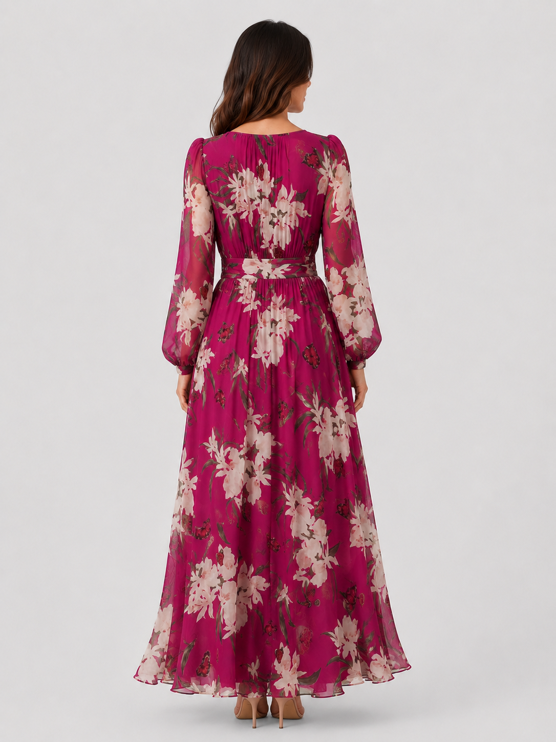 Woman wearing a lightweight floral chiffon maxi dress with a flowing, relaxed silhouette. The dress features an all-over floral print and breathable fabric that drapes softly for comfortable movement. Suitable for warm-weather occasions, casual outings, daytime events, and holiday wear.