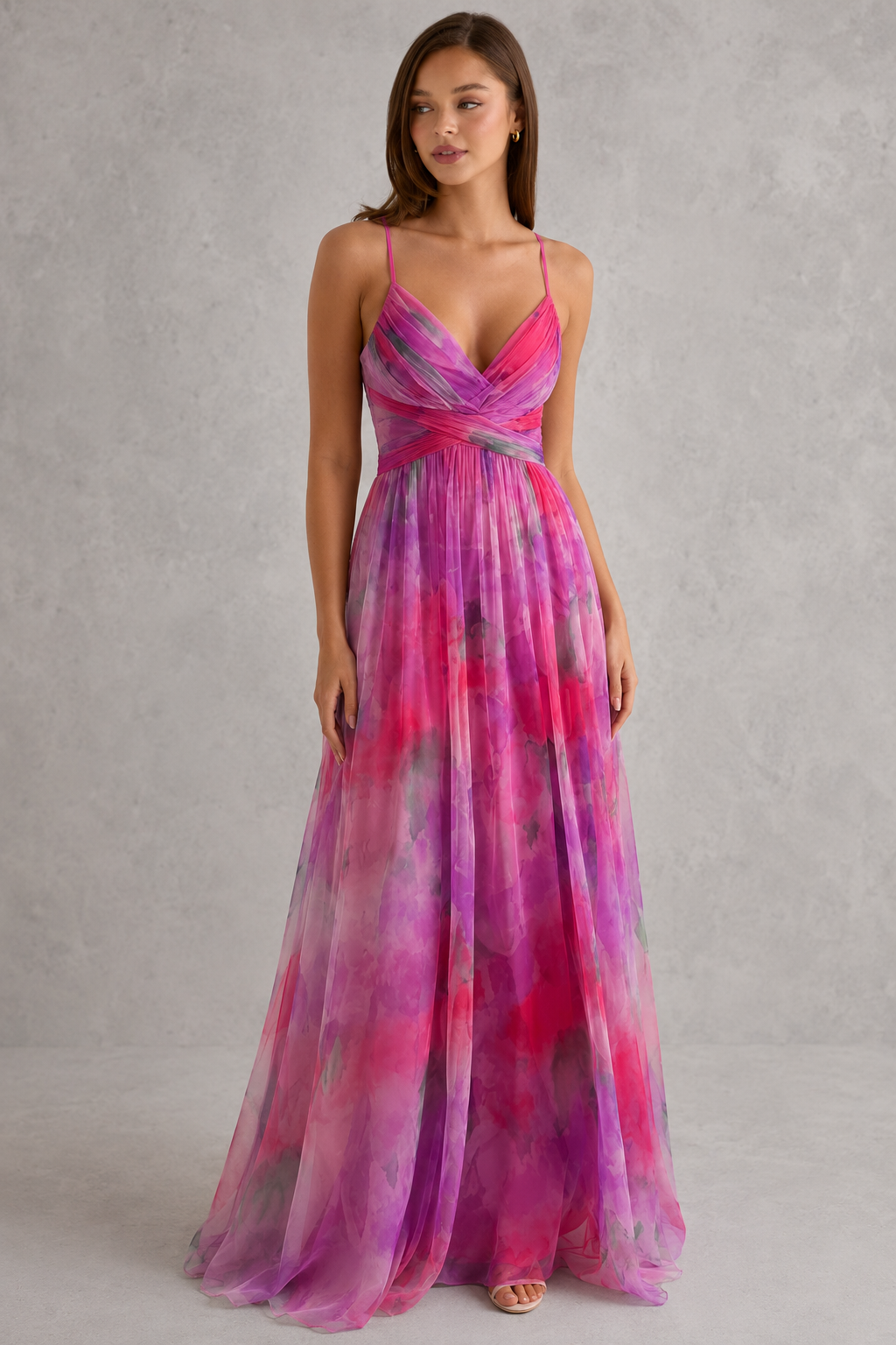 Womenโs floral maxi dress by Klyne Studios featuring a flowing full-length silhouette, adjustable tie-back detail, lightweight breathable fabric, and relaxed fit for warm-weather styling.