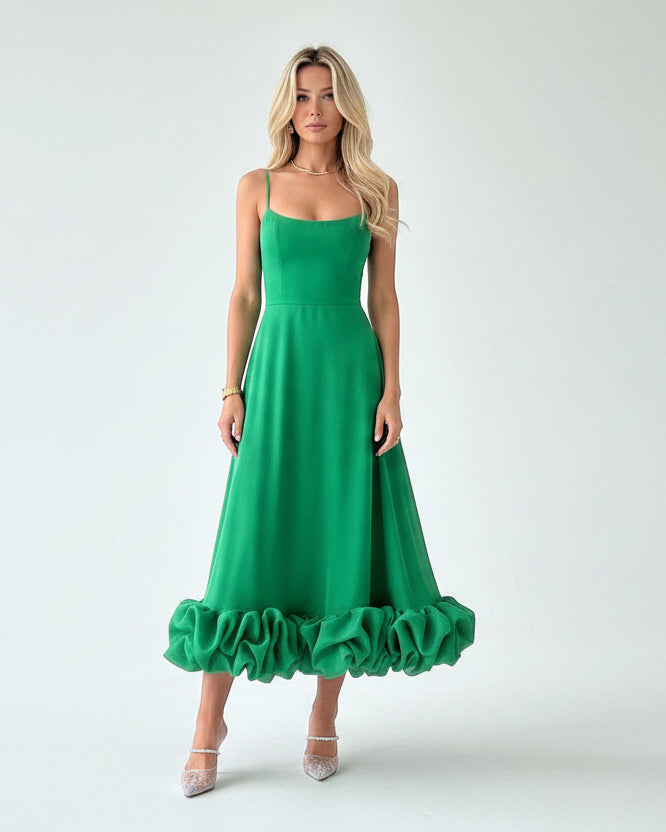 Women’s flowing midi dress with defined waist and lightweight fabric