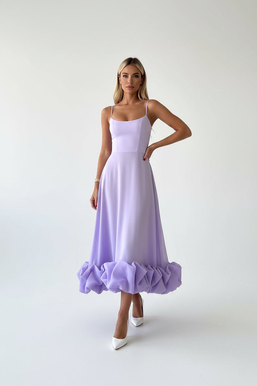Women’s flowing midi dress with defined waist and lightweight fabric